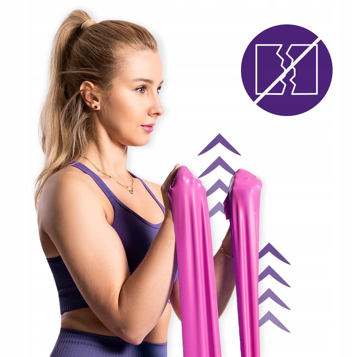 Kobieta ćwicząca z różową taśmą oporową DrFit, pokazująca jej elastyczność i odporność na rozciąganie.